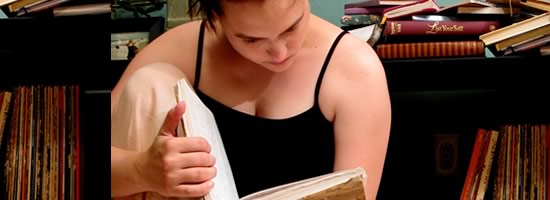 A girl reading through a diary